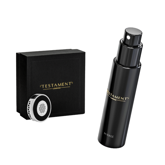 A black cylindrical cosmetic bottle with a matching black pump and nozzle, shown beside a black branded box and a small round applicator tip. The bottle and box both display the TESTAMENT London brand name in gold lettering.